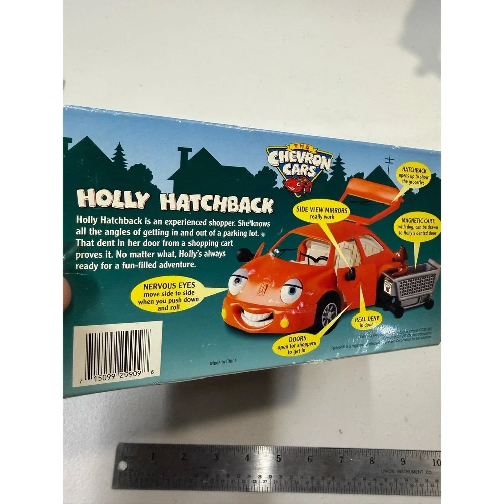 The Chevron Cars Holly Hatchback Orange Toy Car with Dog and Shopping Cart 1997